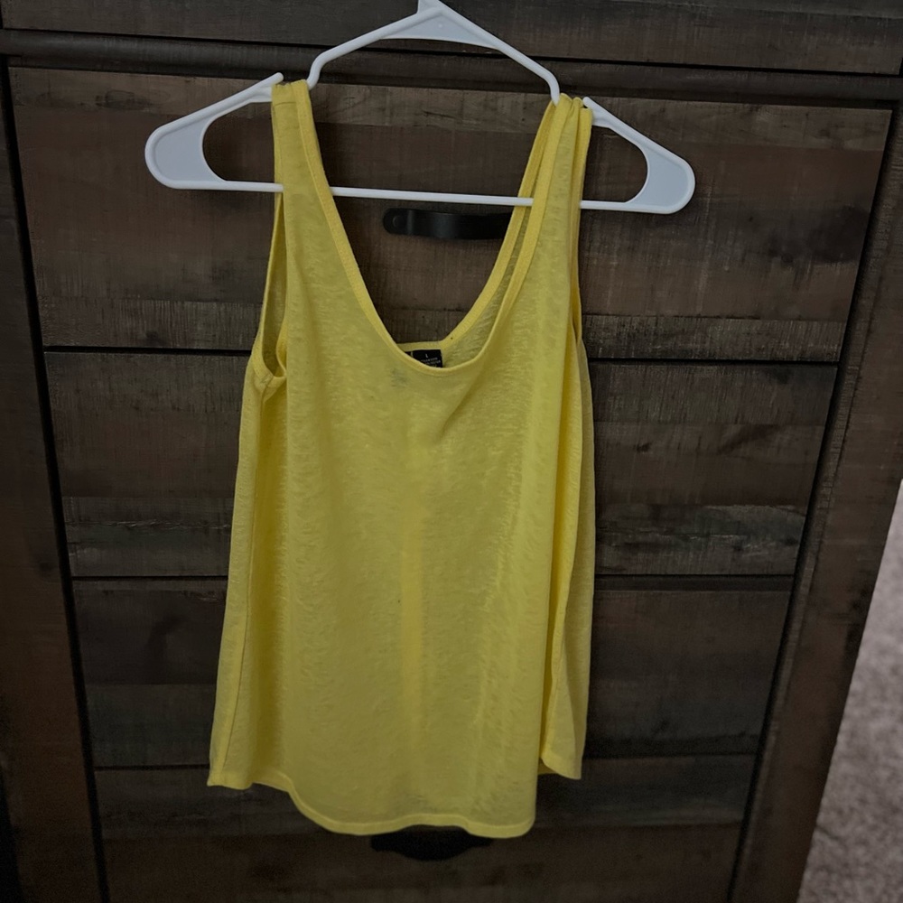Brand is No comment tank tops, button design on the back